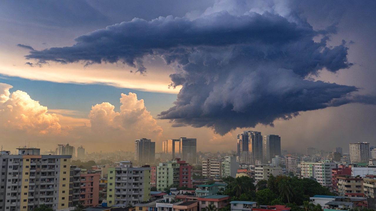 Afternoon thunderstorm building over a tropical city